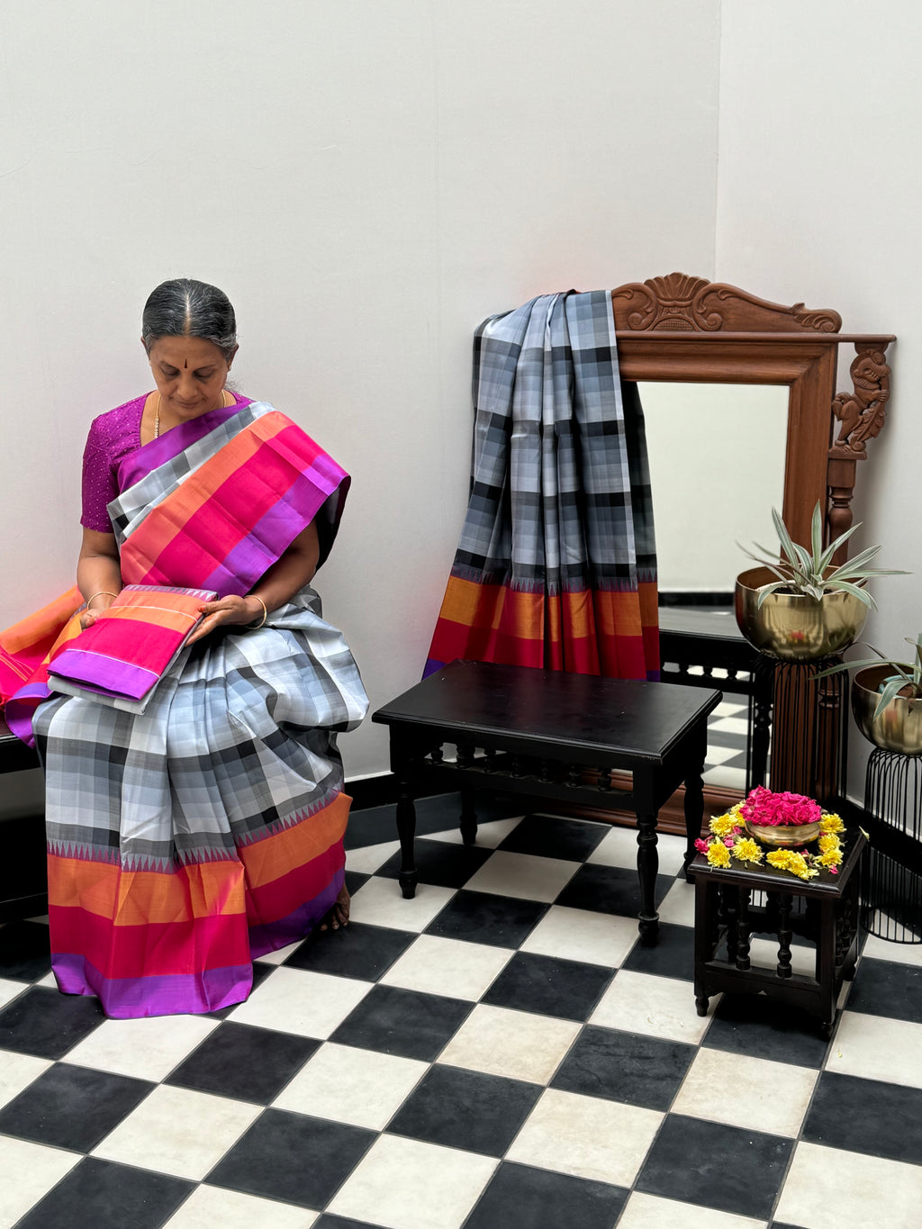 One of the most difficult Kanchivaram Silk - the weaver has to handle seven shuttles ( 5 for body and 2 for the borders ) digital grey black off white chex with three colour band woven borders