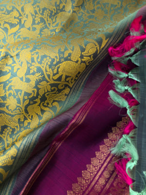 Vanasingaram on Kanchivaram - metallic teal base with mustard silk thread woven vanasingaram with deep dark purple pallu blouse and borders