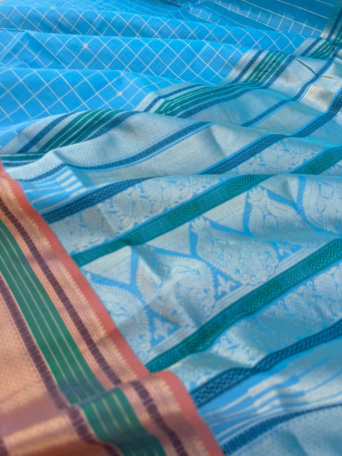 Pastels on Zari Kissed Silk Cotton - a unique powder blue with muthukattam and buttas woven together