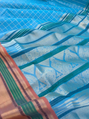 Pastels on Zari Kissed Silk Cotton - a unique powder blue with muthukattam and buttas woven together