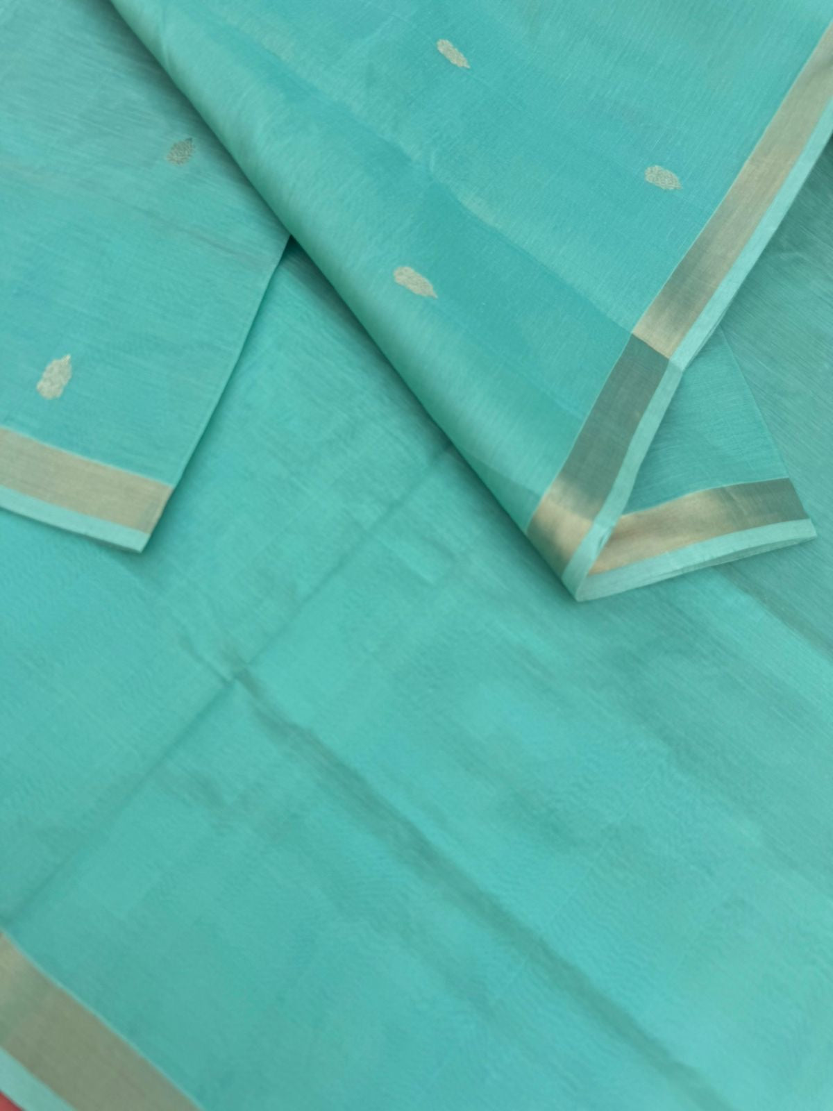 Pastels on Zari Kissed Silk Cotton - a pastel mint green with one inch tissue borders