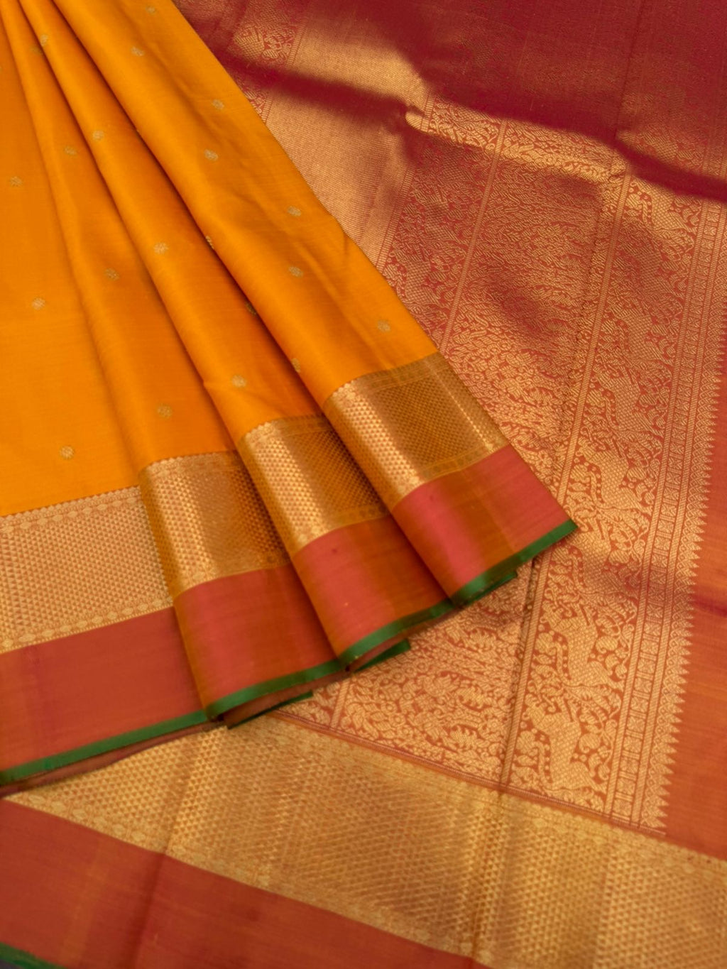 Colour Play on Kanchivaram - traditional at the best mustard and rust with aarai maadam woven borders with gorgeous grand pallu