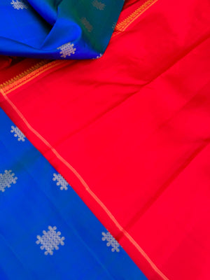 Colour Play on Kanchivaram - peacock blue green kolam buttas woven body with red tone woven pallu and blouse