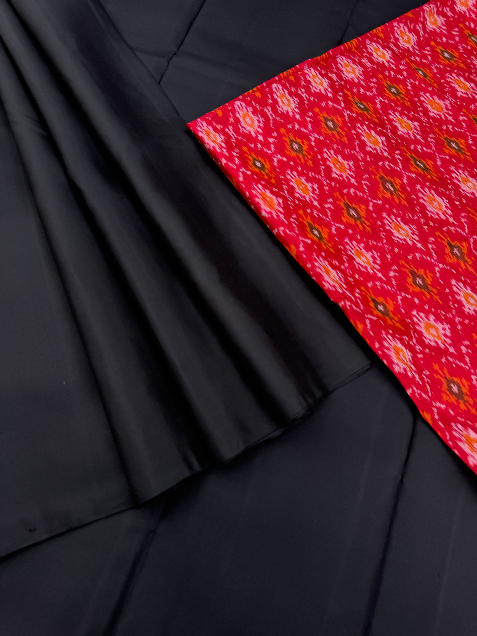 Niram - Celebrating of Full Plain Kanchivaram Silks Paired with Beautiful Blouses - black saree with red ikkat silk blouse