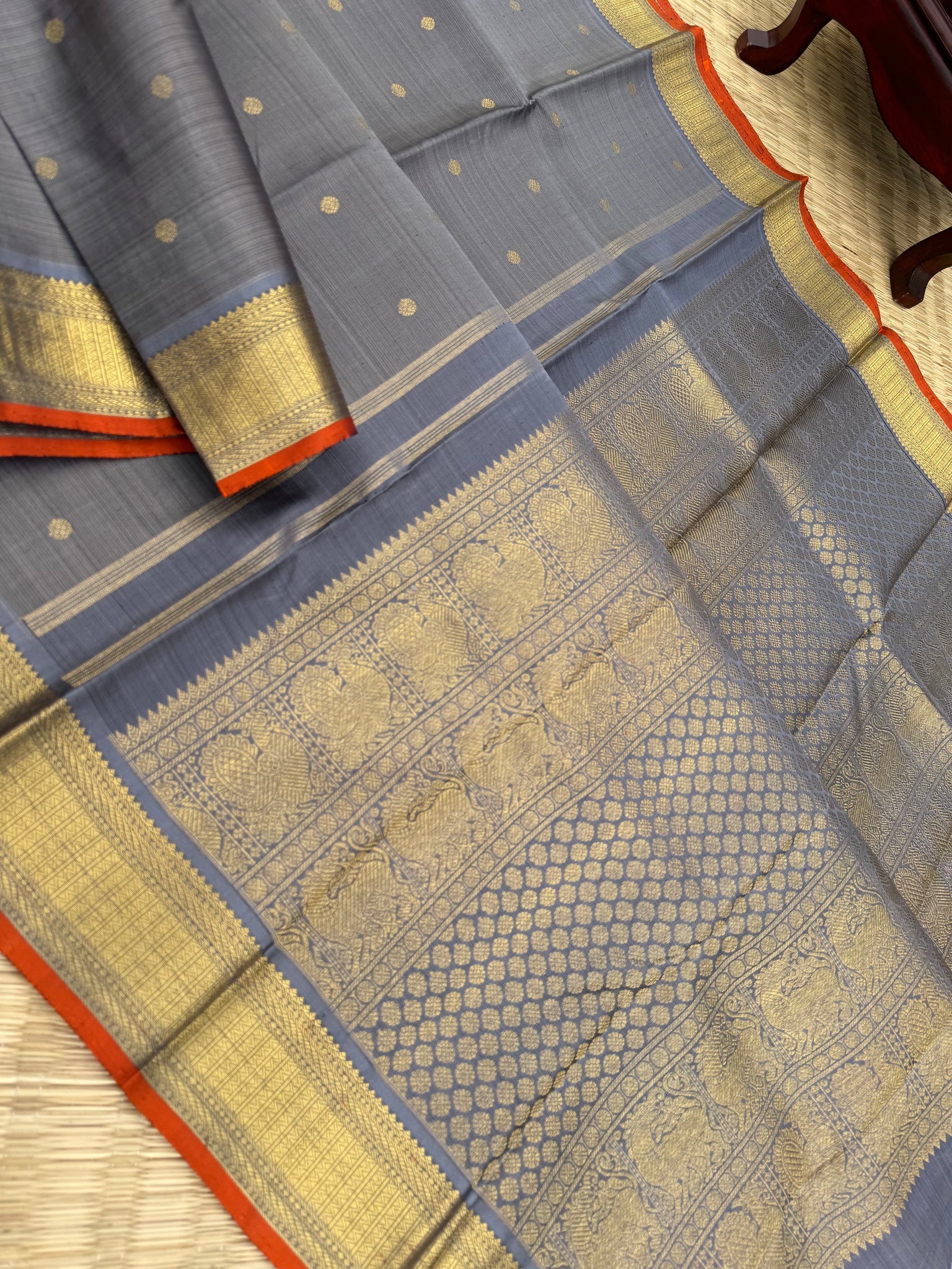 Molten Play on Kanchivaram - a stunning unusual molten Metallic grey vairaoosi the best part of the saree is the burnt orange sleeve edge