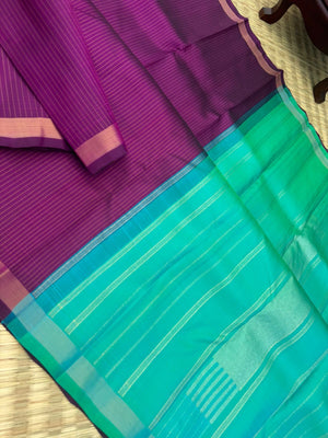 Shree - Simple and Elegant Kanchivarams - a stunning deep purple vertical muthu strips body with a dual tone turquoise blue pallu and blouse