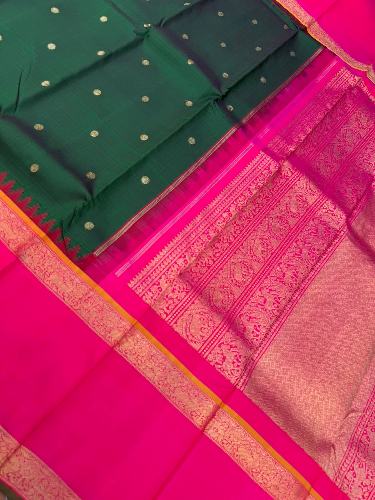 Colour Play on Kanchivaram - deep dark green and pink with broad korvai woven borders