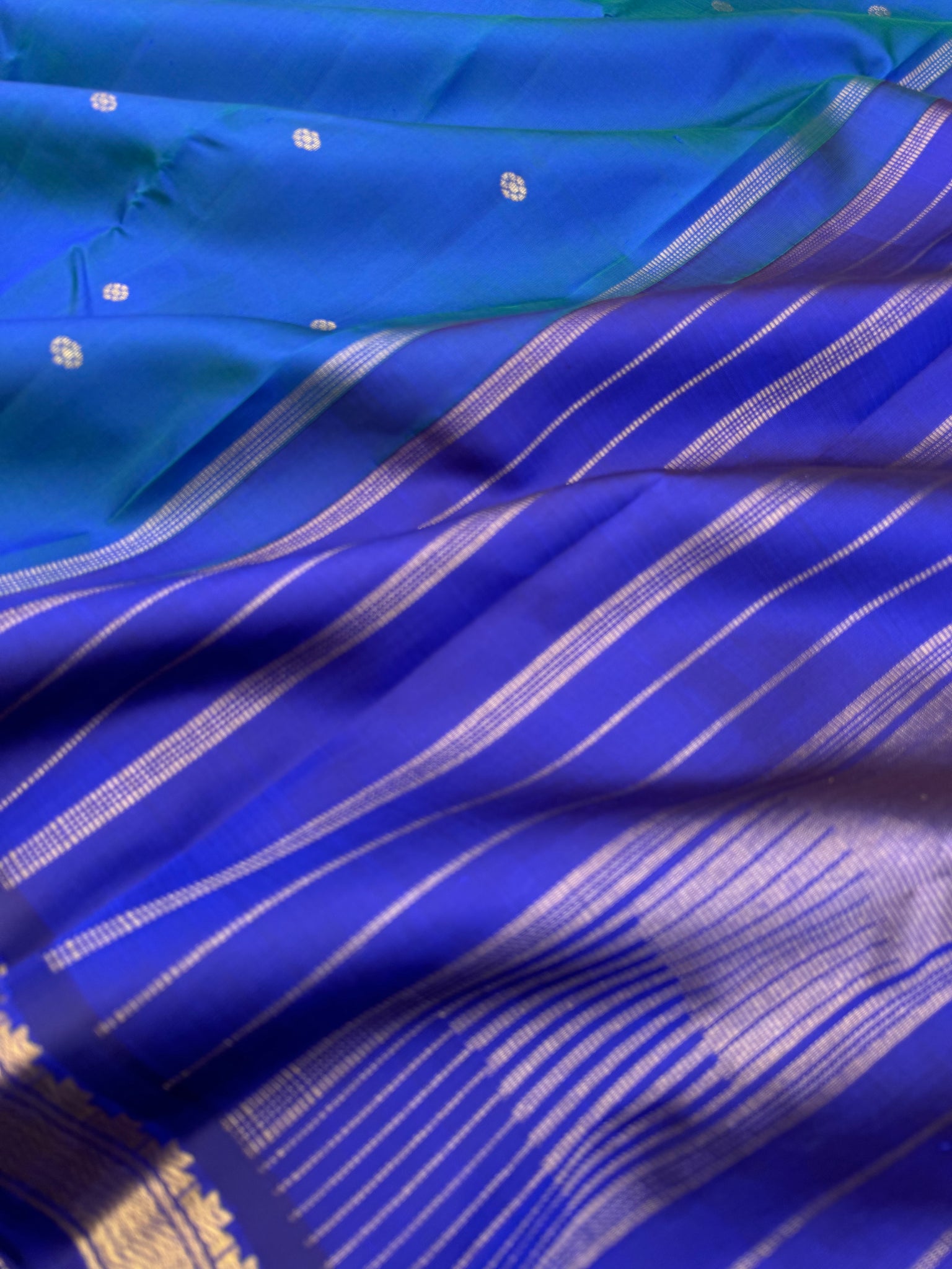 Leela - a mostly beautiful peacock blue green dual tone body with deep dark ink blue pallu and blouse