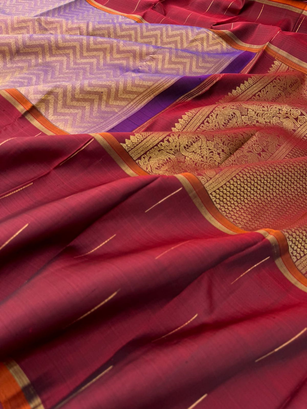 Tasteful Tall Border Kanchivarams - stunning lavender and gold Chevron V woven body with deep red long korvai woven borders with raindrops weave