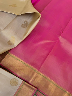 Swarnam - Stunning Solid Border Kanchivarams - off white with a tinch of gold tone body with baby pink pallu