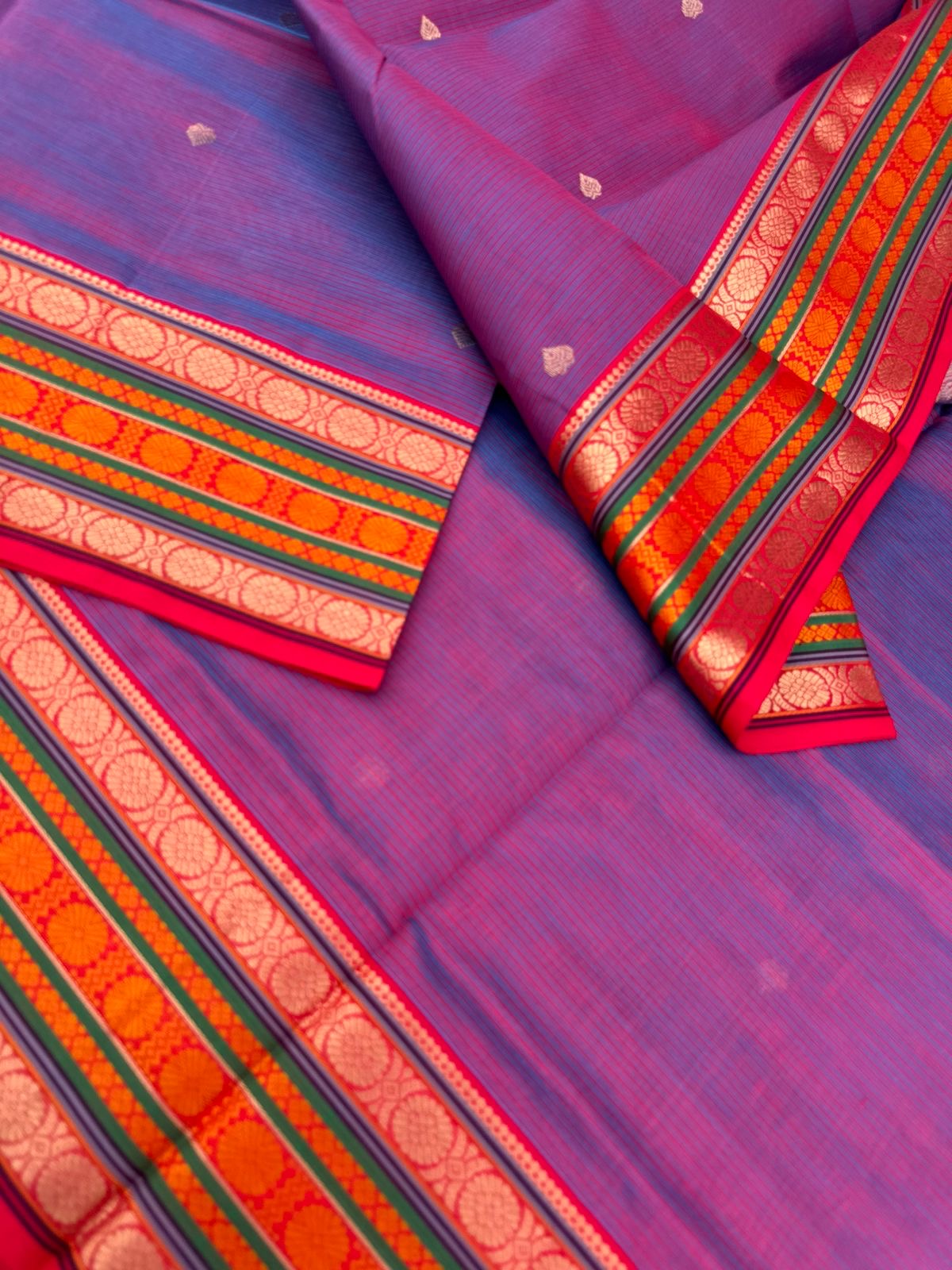 Zari Kissed Silk Cotton - a stunning dual tone red short blue three row of laddu kamalam motifs