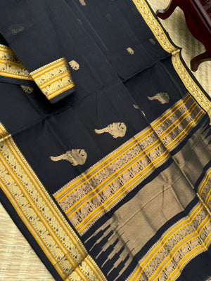 Black Edition of Zari Kissed Silk Cotton - full black and gold with konjum killi woven buttas inbetween the body and pallu