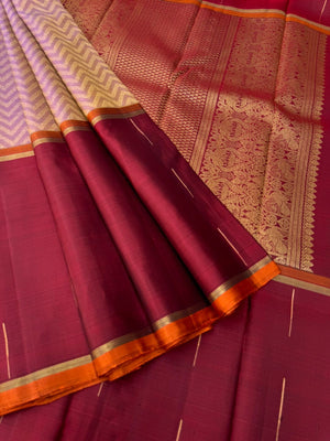 Tasteful Tall Border Kanchivarams - stunning lavender and gold Chevron V woven body with deep red long korvai woven borders with raindrops weave