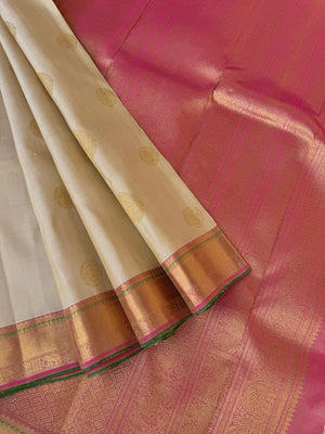 Swarnam - Stunning Solid Border Kanchivarams - off white with a tinch of gold tone body with baby pink pallu