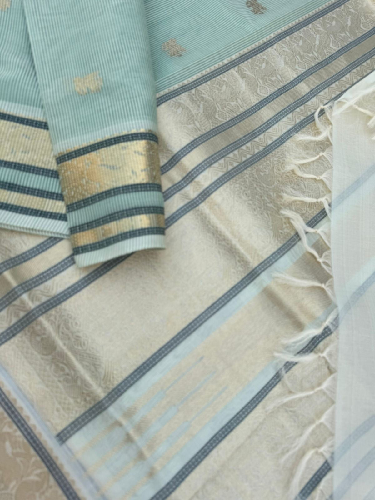 Pastels on Zari Kissed Silk Cotton - pastel pista green best part is the body has a invisible strips will give a gorgeous look when draped