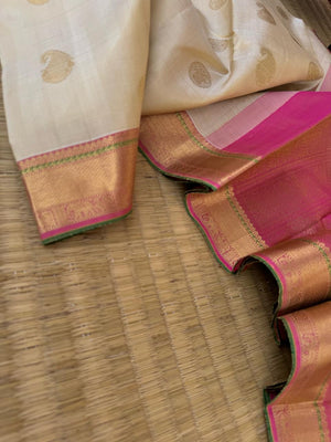 Swarnam - Stunning Solid Border Kanchivarams - off white with a tinch of gold tone body with baby pink pallu