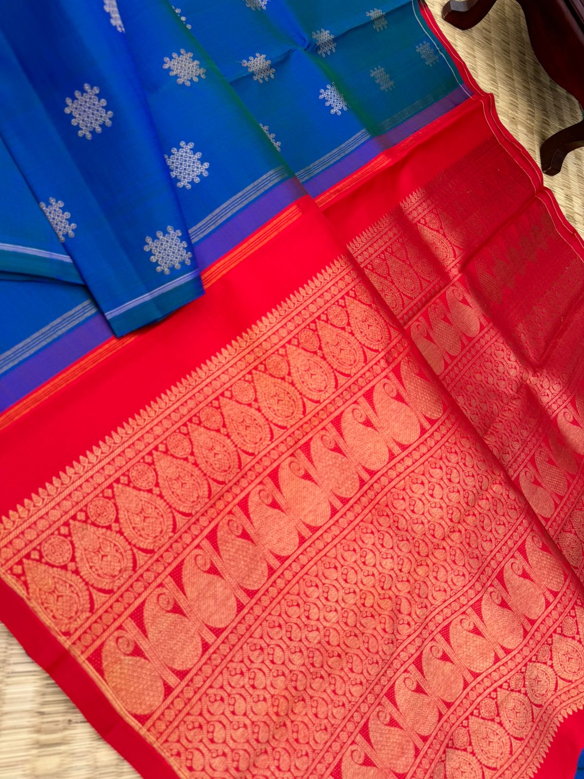 Colour Play on Kanchivaram - peacock blue green kolam buttas woven body with red tone woven pallu and blouse