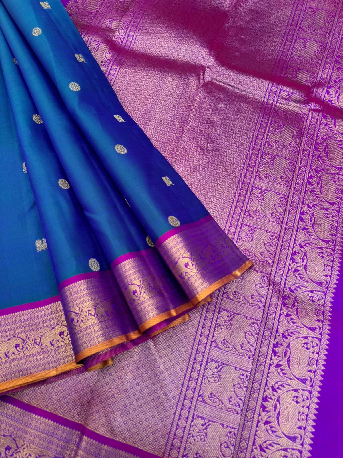 Valli - stunning peacock blue green with violet woven borders and pallu with traditional elephant woven borders