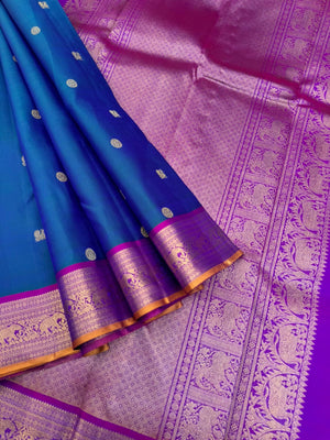 Valli - stunning peacock blue green with violet woven borders and pallu with traditional elephant woven borders