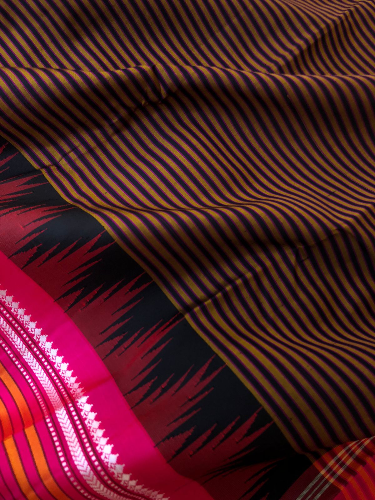 Korvai Connection on Kanchivaram - rust and black oosi vaalapoo stripes woven body with Indian pink borders pallu and blouse