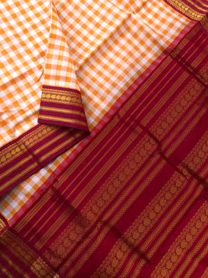 Paalum palamum kattam on Korvai Silk Cotton - off white and orange chex with maroon borders pallu and blouse