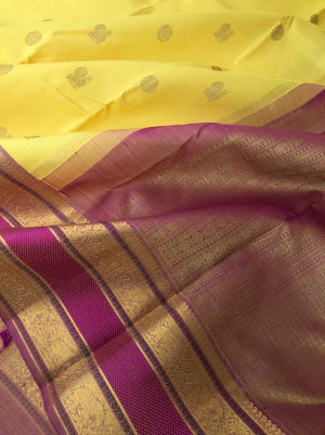 Swarnam - The lineage of Heirloom Kanchivaram - pastel pale lemon yellow and elephant motifs woven rett pett borders
