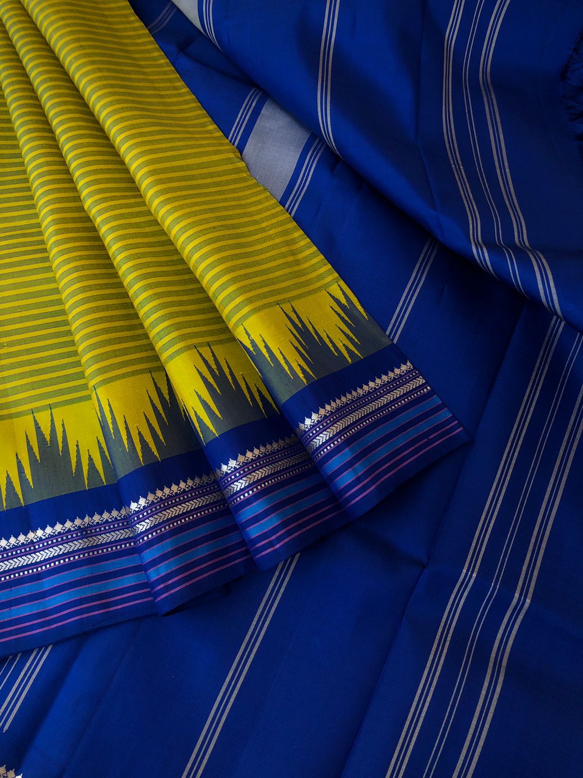 Korvai Connection on Kanchivaram - mustard mixed green oosi valapoo stripes woven body with ms blue pallu and blouse