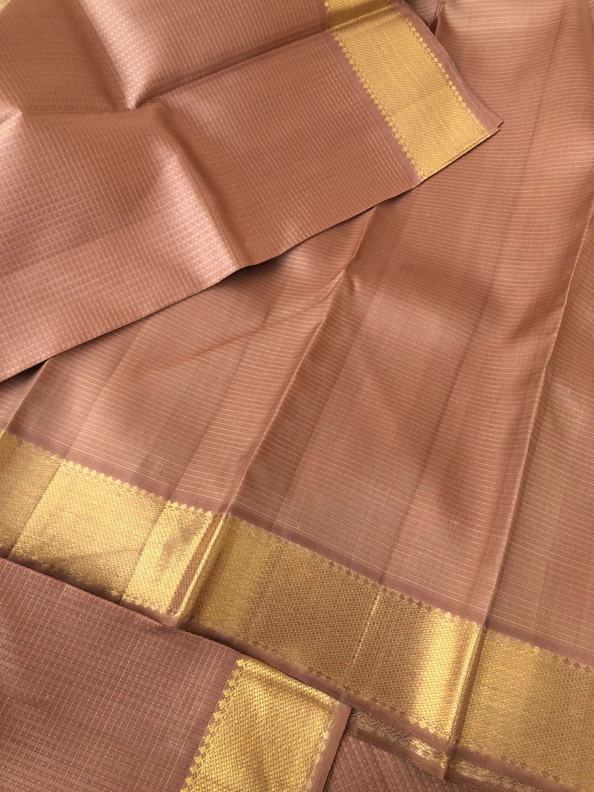 Yarn play on Kanchivaram - biscuit beige and rose gold Lakshadeepam with solid gold borders