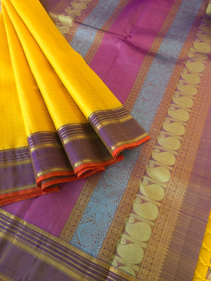 Shree - Bliss of Kanchivarams - the colour play of yellow and pale lavender with gold zari chex woven body with colourful silk thread woven pallu is amazing