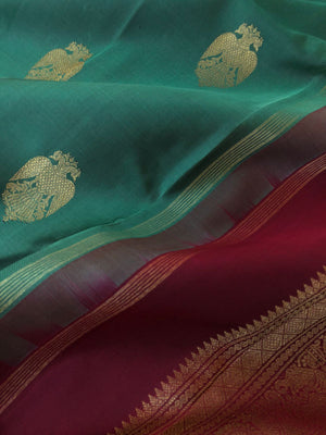 Mohaa - Beautiful Borderless Kanchivarams - unusual metallic mint green and maroon with Irruthalaipakshi woven buttas