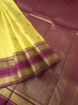 Swarnam - The lineage of Heirloom Kanchivaram - pastel pale lemon yellow and elephant motifs woven rett pett borders