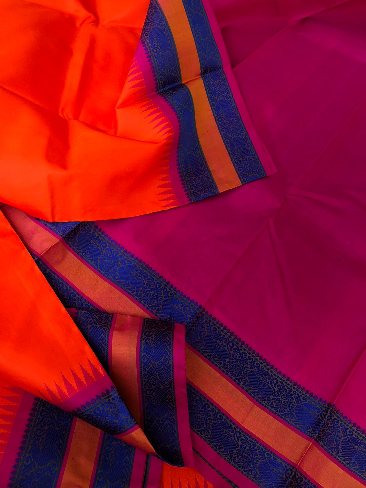 Festive Vibes on No Zari Korvai Kanchivaram - vibrant orange and pink with motifs woven in deep ink blue