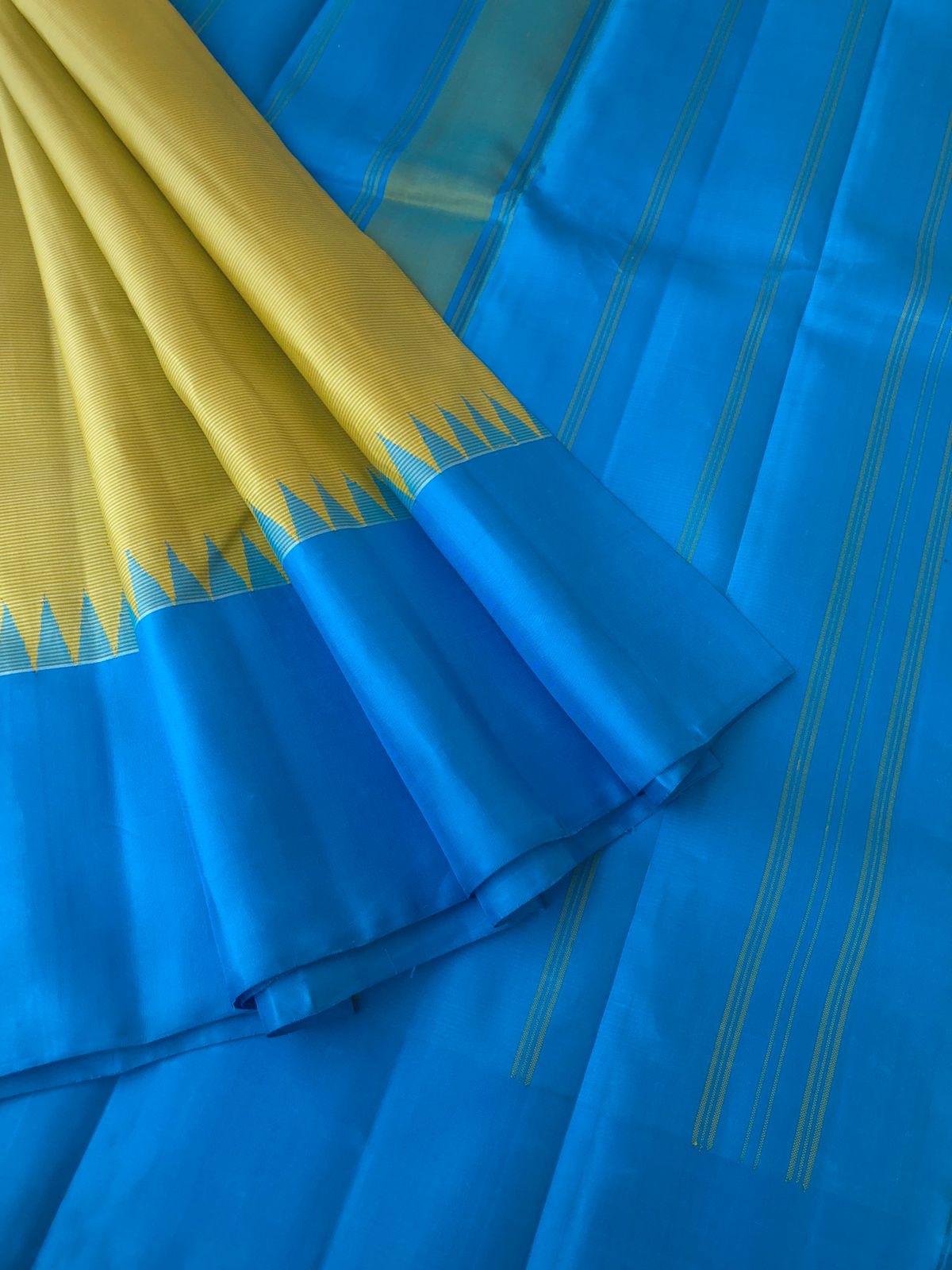 Best of Best Korvai Kanchivaram - beige with a touch of yellow oosi stripes no zari korvai Kanchivaram with sulphate blue pallu borders and blouse