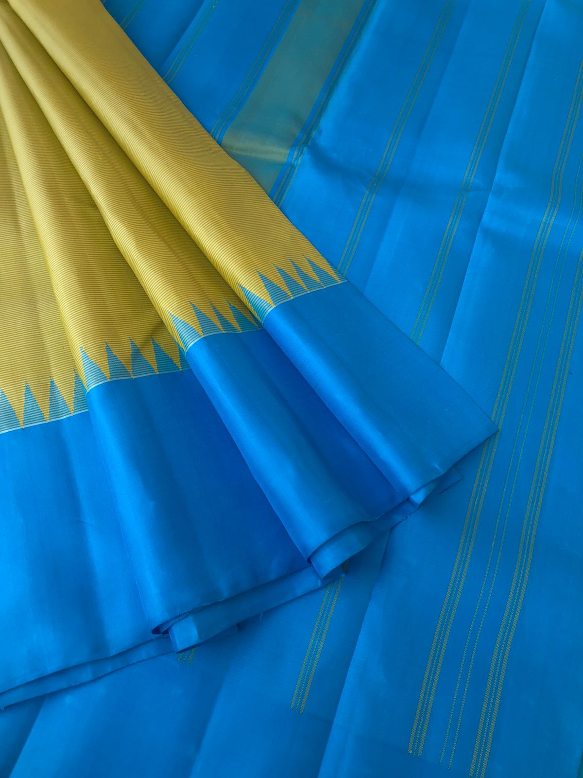 Best of Best Korvai Kanchivaram - beige with a touch of yellow oosi stripes no zari korvai Kanchivaram with sulphate blue pallu borders and blouse