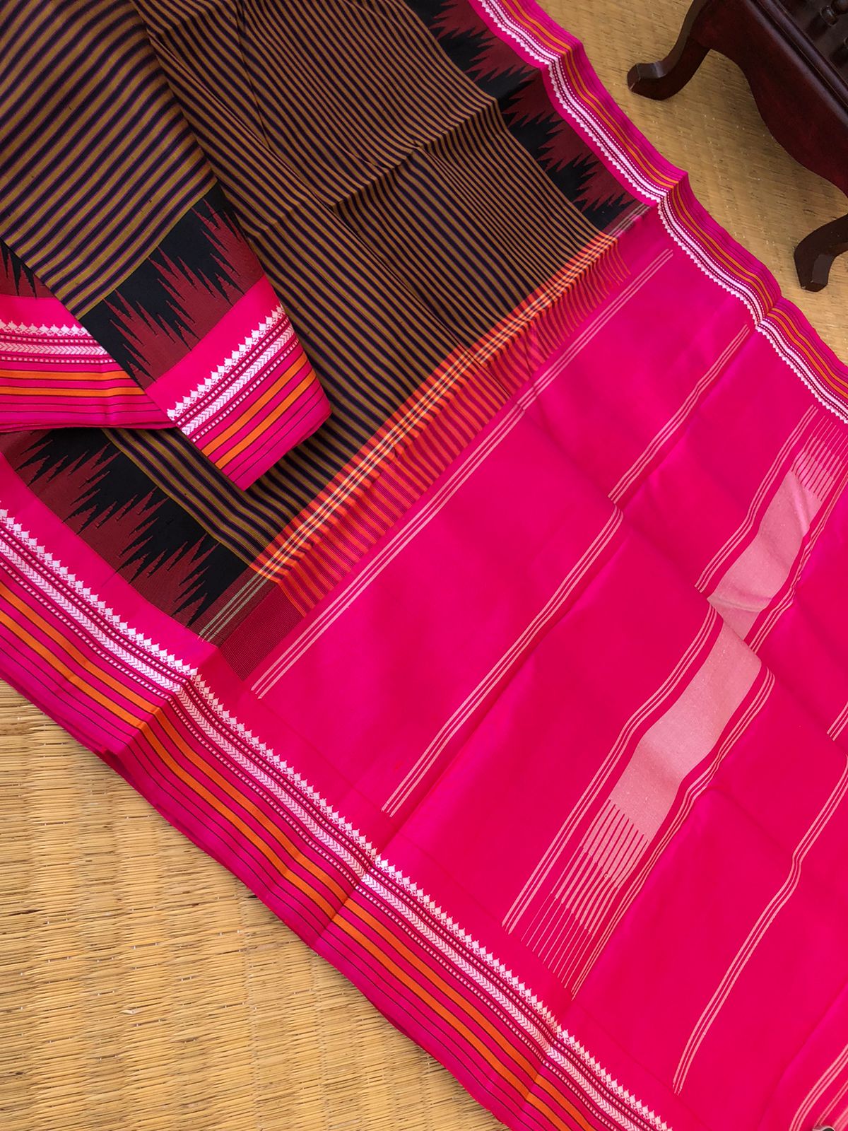 Korvai Connection on Kanchivaram - rust and black oosi vaalapoo stripes woven body with Indian pink borders pallu and blouse