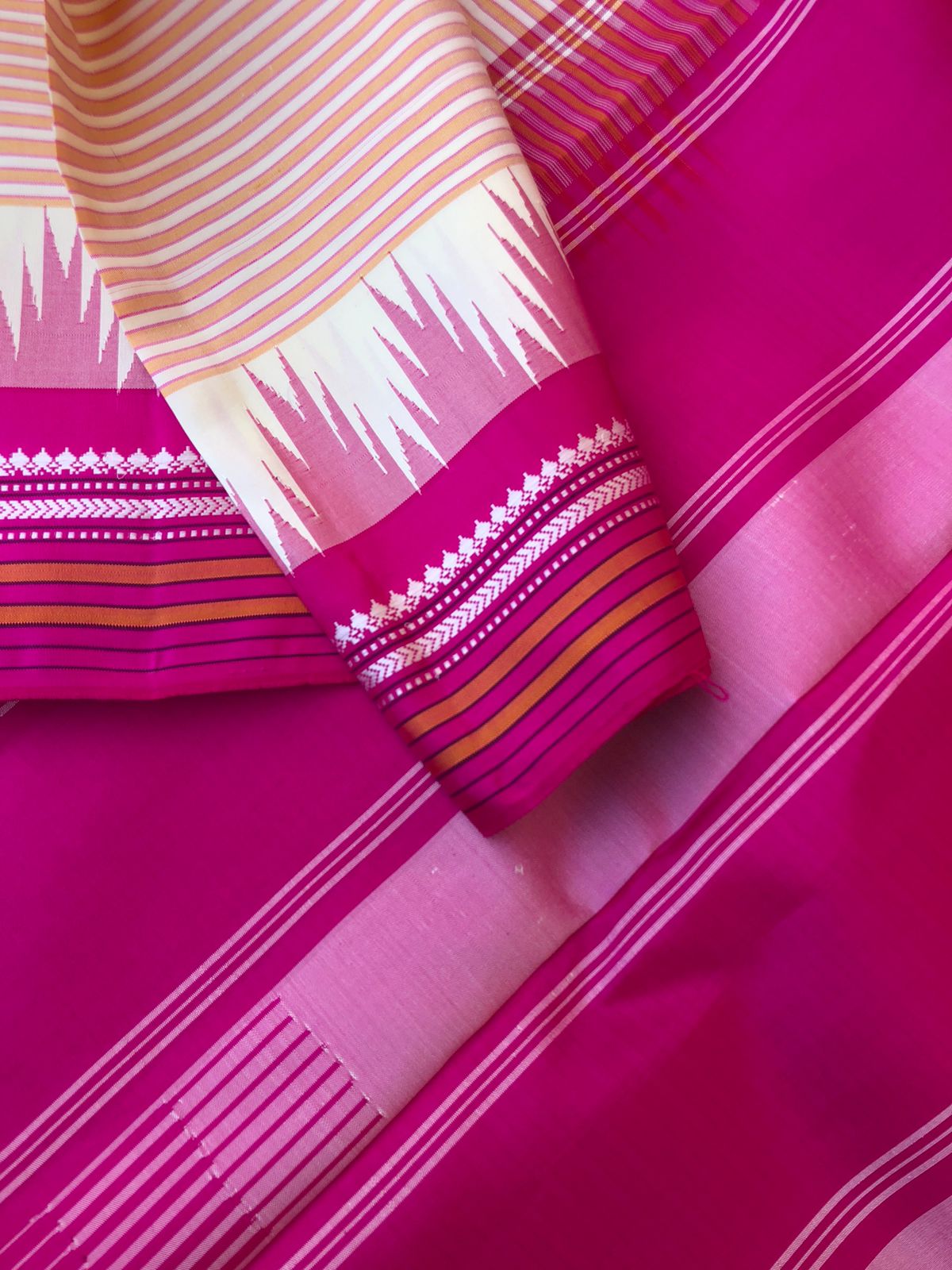 Korvai Connection on Kanchivaram - off white and creamy orange oosi vaalapoo stripes woven body with Indian pink borders pallu and blouse on no zari korvai Kanchivaram