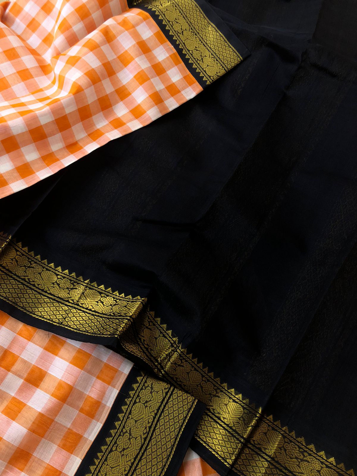 Paalum palamum kattam on Korvai Silk Cotton - off white and orange chexs with black borders pallu and blouse