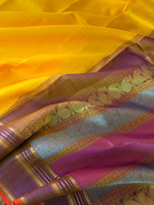Shree - Bliss of Kanchivarams - the colour play of yellow and pale lavender with gold zari chex woven body with colourful silk thread woven pallu is amazing