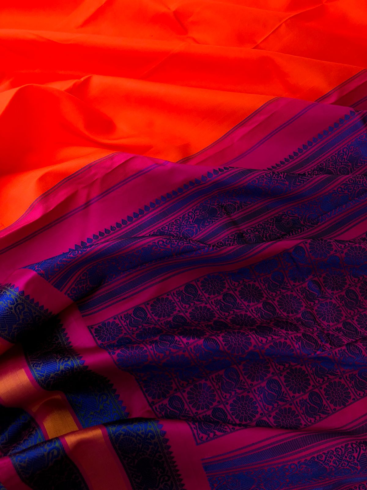 Festive Vibes on No Zari Korvai Kanchivaram - vibrant orange and pink with motifs woven in deep ink blue