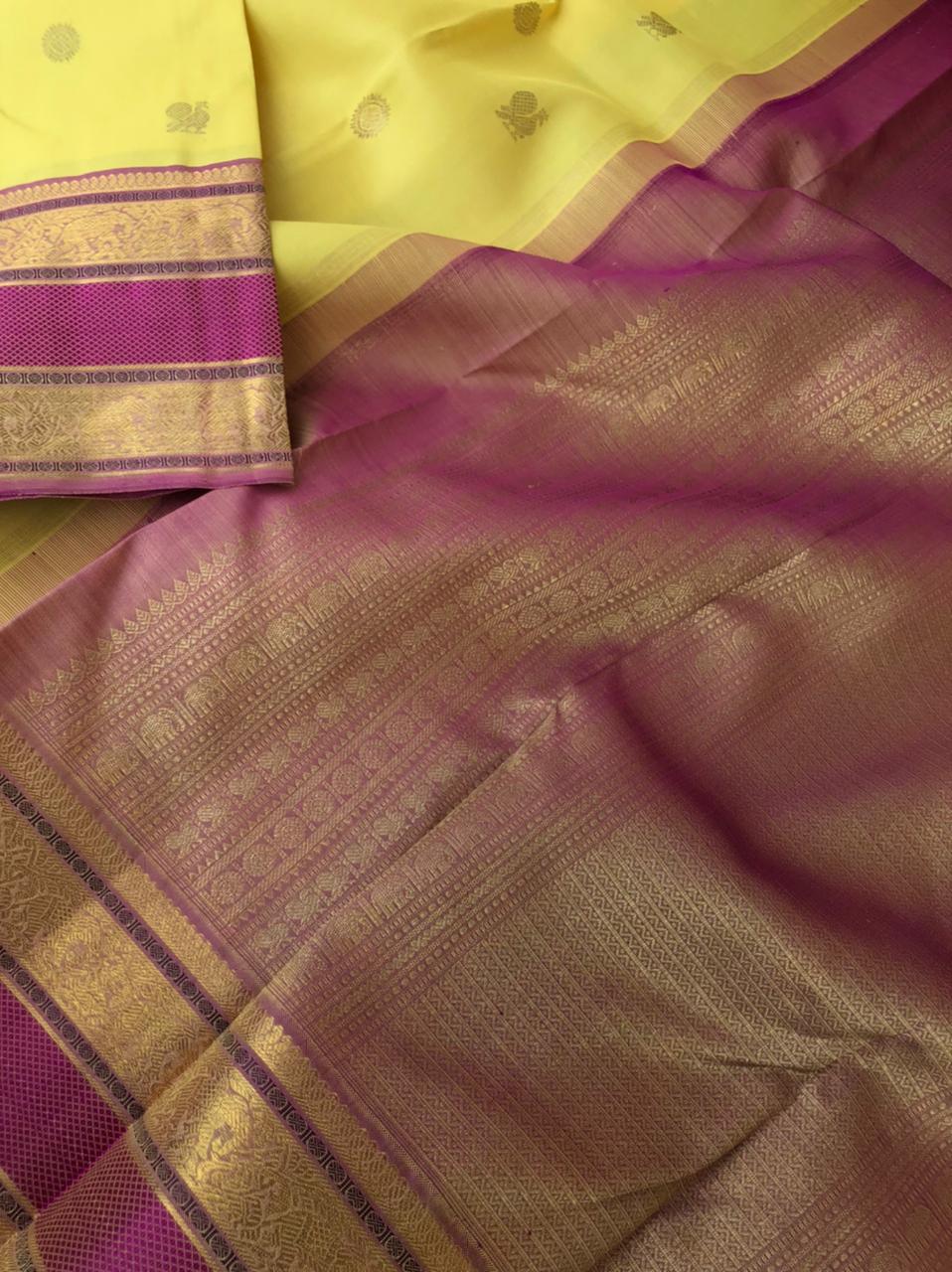 Swarnam - The lineage of Heirloom Kanchivaram - pastel pale lemon yellow and elephant motifs woven rett pett borders
