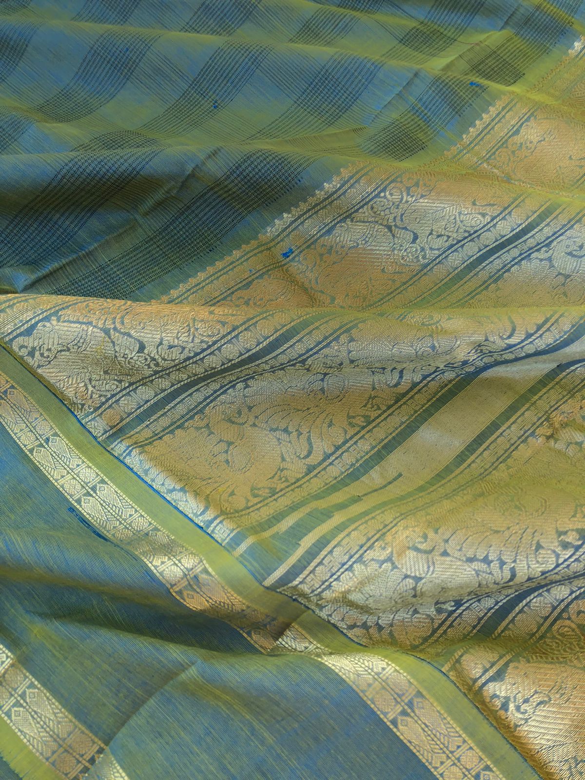 Zari Kissed Silk Cotton - gorgeous chex woven body with fish pett woven borders