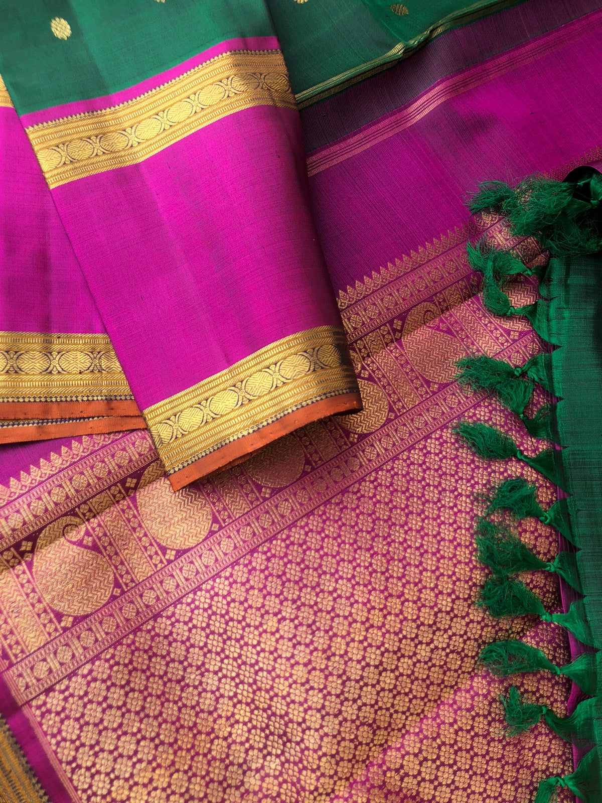 Swarnam - The lineage of Kanchivaram - stunning deep Meenakshi green and majenta pink traditional broad retta pett borders Kanchivaram with intricate buttas woven body