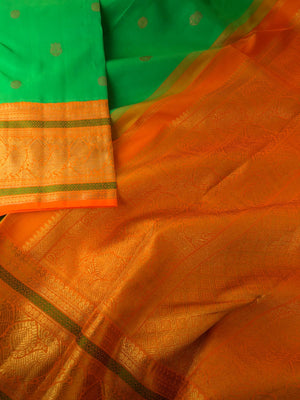 Festive Edits on Kanchivaram - the classy beauty of parrot green and orange kai korvai Kanchivaram with pakshi motifs woven borders