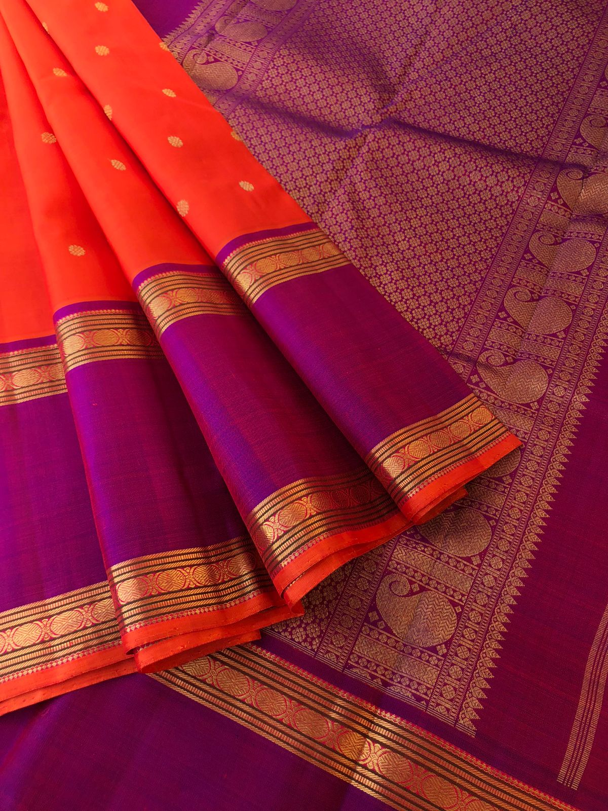 Kamakshi- Traditional Kanchivarams - the best of orange and purple broad borders Kanchivaram with stunning gold zari woven pallu