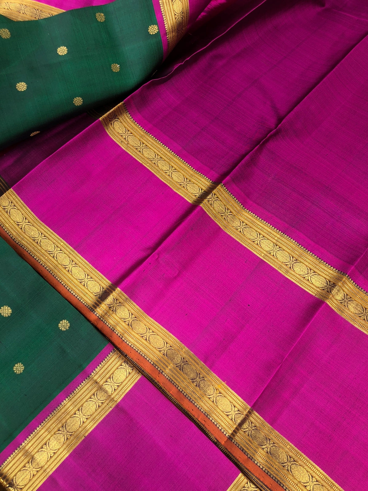 Swarnam - The lineage of Kanchivaram - stunning deep Meenakshi green and majenta pink traditional broad retta pett borders Kanchivaram with intricate buttas woven body