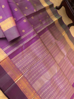 Shree - Exclusive Kanchivarams - a perfect mix of purple and green a dual tone Kanchivaram with super stunning pallu and borders