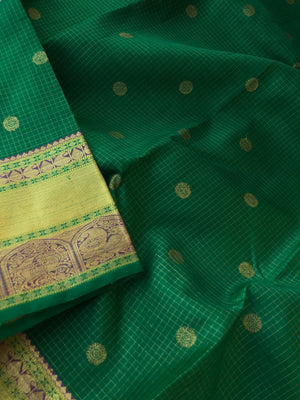 Kamakshi - Traditional kattams on Kanchivarams - most beautiful traditional green and rani pink with podi kattam ( tiny chex) with chackaram buttas over the body with densely woven pallu