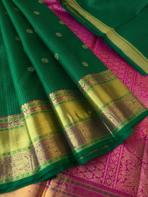 Kamakshi - Traditional kattams on Kanchivarams - most beautiful traditional green and rani pink with podi kattam ( tiny chex) with chackaram buttas over the body with densely woven pallu