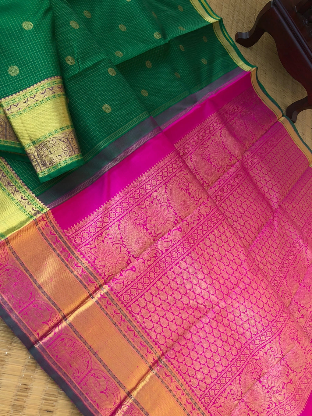 Kamakshi - Traditional kattams on Kanchivarams - most beautiful traditional green and rani pink with podi kattam ( tiny chex) with chackaram buttas over the body with densely woven pallu