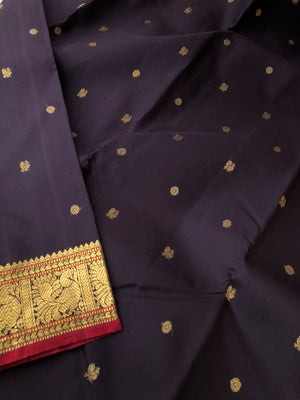 Radhe a album of rare find Kanchivaram - beautiful coal black with small annapakshi woven borders and tiny buttas woven body